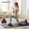 A woman is performing a lunge exercise with dumbbells in a bright, modern living room. Produktbild-Vorschau