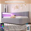 A modern gray upholstered bed frame with integrated purple LED lighting, set in a bedroom with decorative wall art. Produktbild-Vorschau