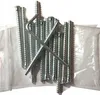 A pile of metal screws and an Allen wrench, likely for assembling furniture. Náhled obrázku produktu