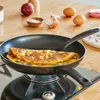 An omelet is being cooked in a Tefal frying pan on a gas stove. Náhled obrázku produktu