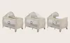 A collage of three images showing different configurations of a baby crib/playpen. Produktbild-Vorschau