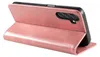 A pink leather flip case for a smartphone is shown standing upright, propped open. Produktbild-Vorschau