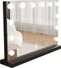 A vanity mirror with LED lights on a black base, reflecting a room with sheer curtains and wooden flooring. Produktbild-Vorschau