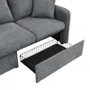 A close-up view of a gray sofa with a storage drawer pulled out. Produktbild-Vorschau