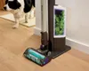A cordless stick vacuum cleaner is shown on a wooden floor next to a dog. Anteprima dell’immagine prodotto