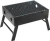 A black portable folding charcoal grill with a wire grate and foldable legs, shown against a white background. Produktbild-Vorschau
