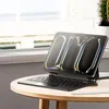 A tablet with a keyboard case is placed on a wooden table next to a window. Anteprima dell’immagine prodotto