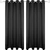 Two black curtains hanging on a curtain rod against a white background.