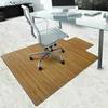 An office chair mat made of bamboo is placed on a light-colored floor in front of a desk. Anteprima dell’immagine prodotto