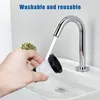 A hand is washing a vacuum cleaner filter under a running faucet in a sink. Produktbild-Vorschau