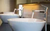 Two modern sinks with running water in a bathroom. Náhled obrázku produktu