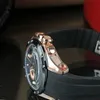 A close-up side view of a Jaguar chronograph watch with a black strap and rose gold accents. Produktbild-Vorschau