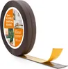 A roll of brown flexible skirting board with adhesive backing is shown, with a portion unrolled to reveal the adhesive side. The product packaging is partially visible, featuring images of a kitchen and bathroom. Náhled obrázku produktu