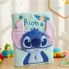 A plush notebook with a Stitch character design, surrounded by children's toys and a book. Anteprima dell’immagine prodotto