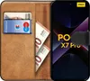 A book-style phone case is open, showing a credit card and Euro banknotes inside, with a smartphone inserted. Podgląd zdjęcia produktu