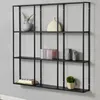 A black metal wall shelf with multiple compartments, mounted on a gray wall. It is decorated with various items like vases, books, and decorative objects. Náhľad obrázku produktu