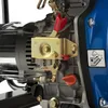 A close-up view of the engine components of a generator, focusing on the control panel and fuel cap. Anteprima dell’immagine prodotto