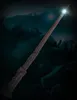 A close-up of a Harry Potter wand with a glowing tip against a dark, atmospheric background. Produktbild-Vorschau