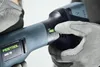 A close-up shot of a person wearing grey work gloves holding a Festool angle grinder. Produktbild-Vorschau