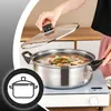 A person is placing the lid on a pot of food on a stovetop. Voir les images du produit