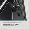 A close-up view of a turntable's speed selection mechanism and part of the record. Produktbild-Vorschau