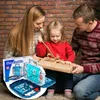 A family is opening a Christmas gift, which is a board game. Produktbild-Vorschau