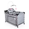 A doll's crib with a mobile and a changing station attachment. Produktbild-Vorschau