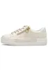 A single beige sneaker with a white sole and gold zipper detail, shown from the side against a white background. Náhled obrázku produktu