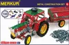 The image shows the packaging of a Merkur metal construction set, featuring a model tractor with a trailer. Podgląd zdjęcia produktu