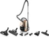 A gold and black vacuum cleaner with multiple attachments displayed around it on a white background. Náhled obrázku produktu
