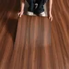 A person is installing a self-adhesive wood-look floor sticker. Anteprima dell’immagine prodotto