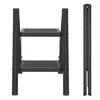 A black metal step stool is shown from the front and side, both open and folded. Náhled obrázku produktu