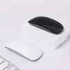 Two computer mice, one black and one white, are displayed on a white surface with a white box. A portion of a keyboard is visible in the foreground. Produktbild-Vorschau