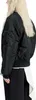A person wearing a black bomber jacket and black pants with a white overlay. Produktbild-Vorschau