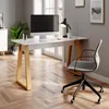 A modern home office setup with a white and wood desk, computer, lamp, and chair. Voir les images du produit