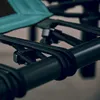 A close-up view of the bungee cords and frame of a fitness trampoline. Voir les images du produit