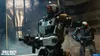 Two futuristic robots in a dimly lit industrial setting. Produktbild-Vorschau