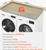 A wooden countertop placed on top of two washing machines. Náhled obrázku produktu