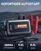 A jump starter power bank is shown on top of a car engine, with a mountainous landscape in the background. Produktbild-Vorschau