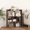 A bookshelf filled with books and decorative items, placed against a white wall. Produktbild-Vorschau