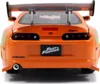 The rear view of an orange Jada Toys 1:24 scale Fast & Furious 1995 Toyota Supra model car. Anteprima dell’immagine prodotto