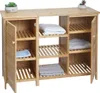 A bamboo bathroom cabinet with slatted shelves and two doors, containing folded towels and a small plant on top. Podgląd zdjęcia produktu
