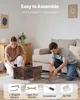 Two people assembling a furniture item on the floor, with various tools and accessories shown at the bottom. Podgląd zdjęcia produktu