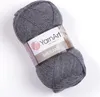 A ball of grey yarn with a label. Produktbild-Vorschau