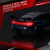 A close-up rear view of a blue remote control drift car with its red tail lights illuminated, set against a dark, reflective surface. Podgląd zdjęcia produktu