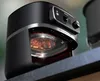Close-up of a black Philips air fryer with its heating element visible. Podgląd zdjęcia produktu