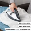 A person is ironing a white cloth with a steam iron. Voir les images du produit