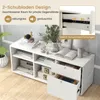 A white storage cabinet with drawers and shelves, displayed in a room setting with decorative items. Anteprima dell’immagine prodotto