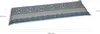 A long, rectangular cushion with a patterned design, shown from a slightly elevated angle with dimensions indicated. Produktbild-Vorschau