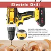 A close-up of a yellow and black electric drill with a battery pack, set against a wooden surface with wood shavings. Produktbild-Vorschau